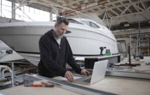 Man working on computer by Andrea Piacquadio | Captain's Tips yacht management | Marinalife